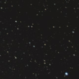 Pluto bei NGC 6439 - eine kosmische Begegnung